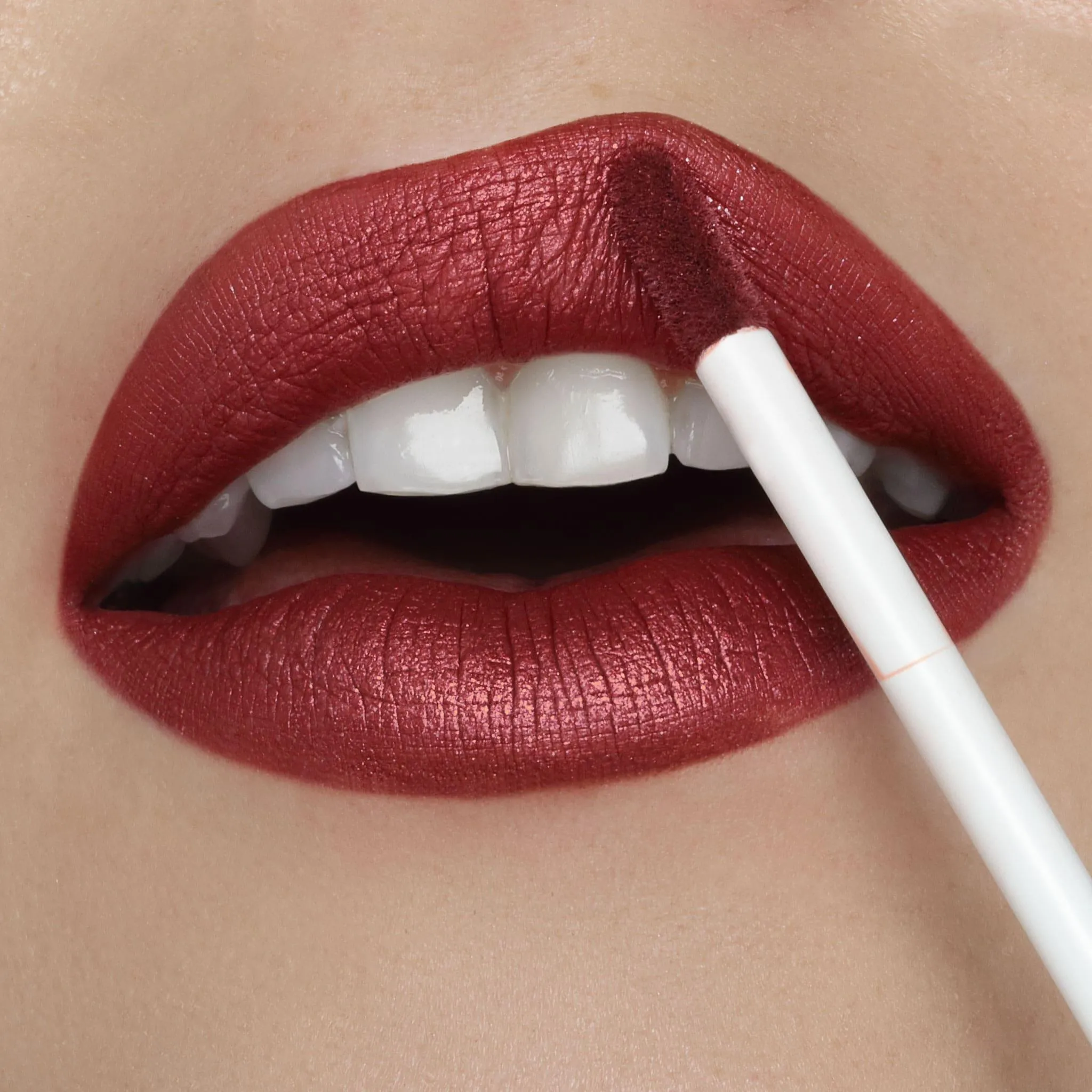 Showtime | A Warm Brick Red With Gold And Silver Shimmer Liquid Lipstick